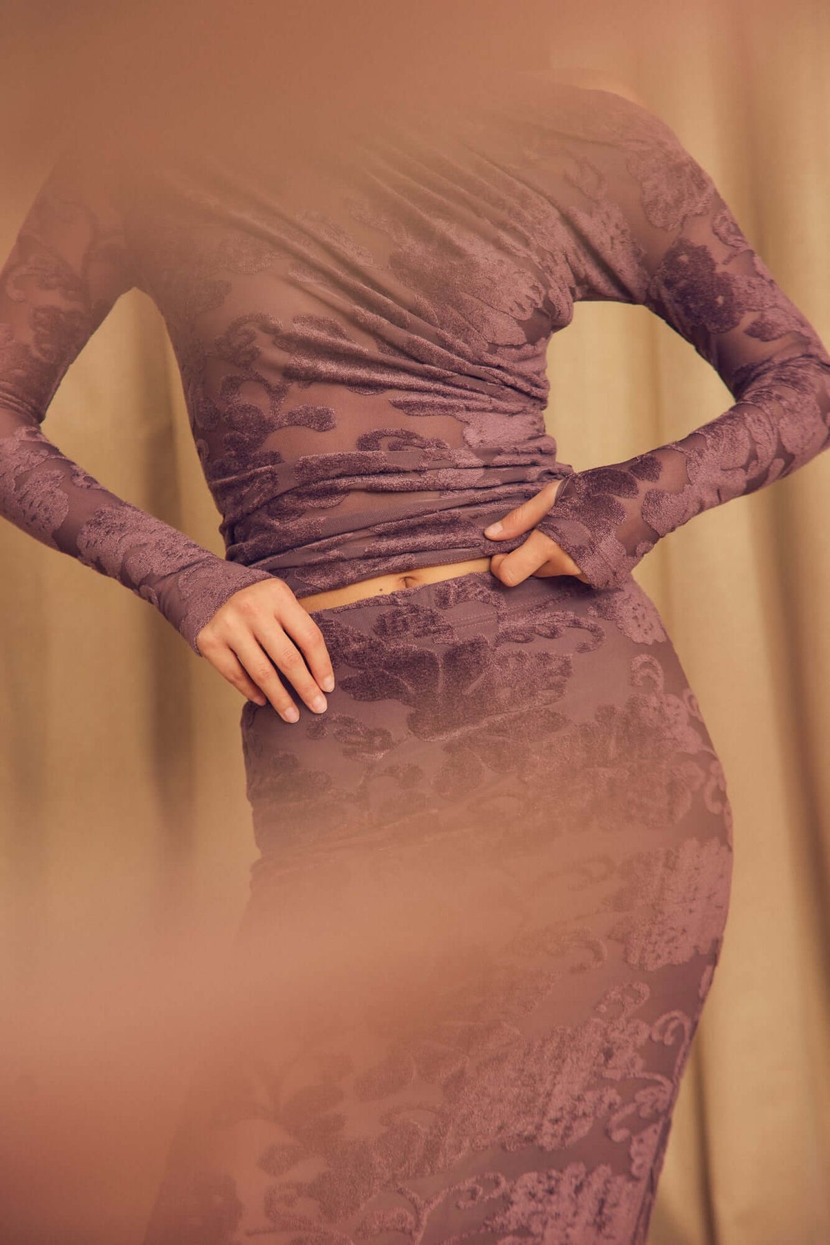 Model wearing Cocoa Devoré Fitted Midi Skirt with a matching long-sleeve top, showcasing the unique devoré texture.