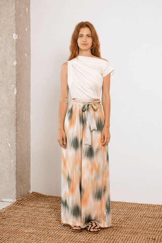 Model wearing Printed Ecovero Viscose Wide-Leg Trousers with a stylish top in a light setting.