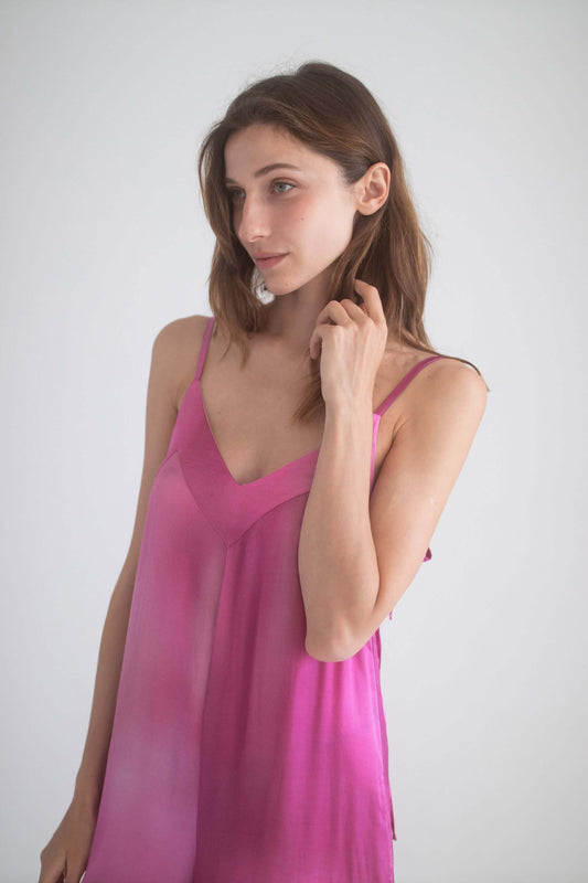 Model in a pink Printed Wide Jumpsuit showcasing adjustable shoulder straps and elegant fabric drape.